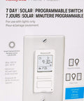 Honeywell programmable timer switch for incandescent and halogen lighting, 40-500 watts, 120V, single pole installation instructions visible.