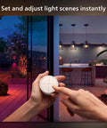 Person adjusting Wall Tap Dial Dimmer Switch For Smart Lights White 1 Pack Easy Wireless Setup No Wiring Required Requires Bridge