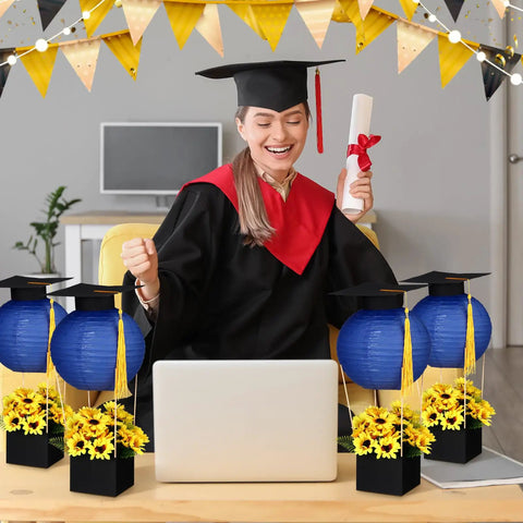 Woman in graduation attire with Six Set Graduation Table Centerpieces With Hot Air Balloon Paper Lanterns And Tassel Caps