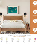 Killer Plug In Wall Sconces Set Of Two With Vintage Wood Accents And Matte Black Bases serving as bedside lighting in modern bedroom.