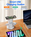 Straight Up Essential Power Strip Tower And Charging Station With Nine AC Outlets And Eight USB Ports Featuring A Super Compact Vertical Design Plus A Retractable Flat Cord For Easy Desk Organization on wooden desk.