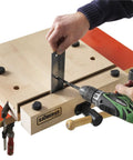 Heavy Duty Portable Woodworking Vise Offering Ridiculous Grip and Chunky MDF Top Slick Design in use with wooden workbench.