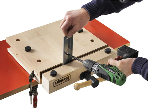 Heavy Duty Portable Woodworking Vise Offering Ridiculous Grip and Chunky MDF Top Slick Design in use with wooden workbench.