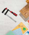 Killer 6 Inch F Clamp Heavy Duty Metal Bar With Strong Clamping Pressure For Woodworking And Welding One Hand Operation on a workspace.
