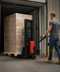 Heavy Hitting Electric Walkie Pallet Stacker With Strong 1.6 Kw Motor Plus Steel Frame Boasting Two Thousand Two Hundred Four Pound Capacity And Ninety Eight Inch Lift Height For Dock To Rack Yard Work in use moving a large pallet.