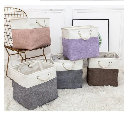 Chunky Foldable Linen Fabric Storage Basket With Tough Cotton Rope Handles, Collapsible Cube Bin For Closets, Laundry Hampers And Laid Back Home Organization, Quick Fold Space Saver in assorted colors.
