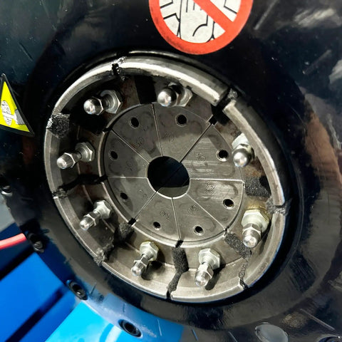 Close-up of Heavy Duty Vertical Electric Hydraulic Hose Crimping Machine With Rock Solid Alloy Steel Dies showing alloy die set and fittings.