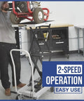 Man using Rock Solid Hydraulic Lift Table Cart Two Speed Rolling Work Platform for easy height adjustments.