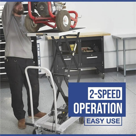 Man using Rock Solid Hydraulic Lift Table Cart Two Speed Rolling Work Platform for easy height adjustments.