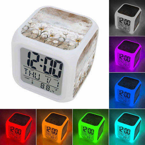 Straight Fire Floral Cube Digital Alarm Clock With Seven Color LED Nightlight featuring sleek design and smooth silicone buttons.