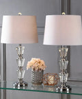 27 Inch Clear Crystal Table Lamp Set Of 2 With Glam Traditional Chrome Accents, White Linen Shade, placed on a glass table