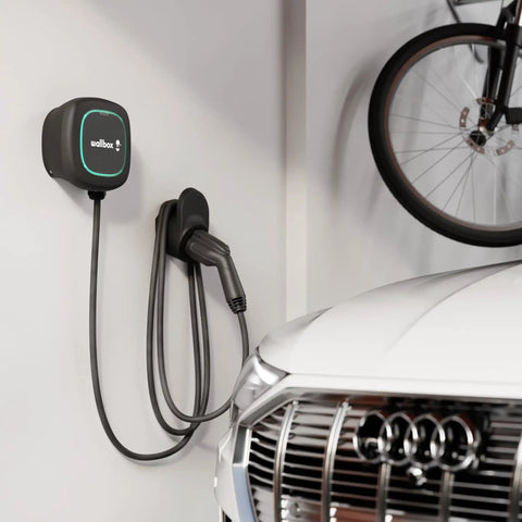 Premium Wall Mounted Level 2 Ev Charger Delivering 48 Amps For Heavy Duty Electric Whip Charging And Up To 45 Miles Range Per Hour Universal J1772 Standard Plug And Play Design Perfect For Garage Or Driveway Zap Juice Installations with charging cable mounted in garage.