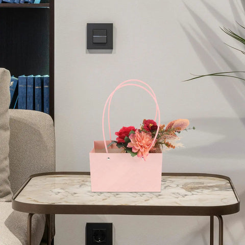 Pink Flower Bouquet Bags With Handle 10 Pack Pro Grade Kraft Paper Floral Packaging Bags on a table with flowers