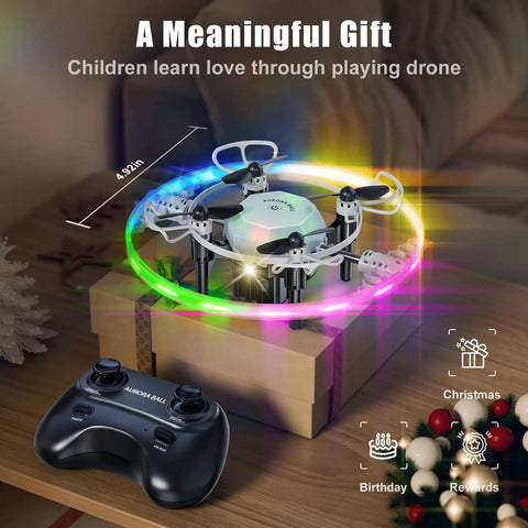 Mini RC Drone Quadcopter For Kids With 360 Degree Flip resting on gift box, lit neon LED lights, controller nearby