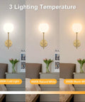Gold Wireless Wall Sconces Set Of Two With Rechargeable Battery And Remote features three color temperatures in a cozy bedroom setting.