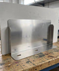 Heavy Duty Outdoor Charger Rainproof Cover Keeps Your EV Station Secure When Weather Beats Down Universal Stainless Steel Electric Box Protector mounted on workshop table.