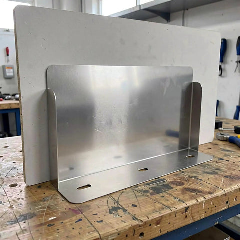 Heavy Duty Outdoor Charger Rainproof Cover Keeps Your EV Station Secure When Weather Beats Down Universal Stainless Steel Electric Box Protector mounted on workshop table.