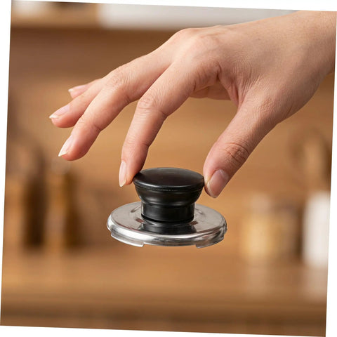 Upgrade Your Kitchen Game With This Stainless Steel Whistling Kettle Lid Knob Replacement Kit That Boils Over Spills Stop Loud And Is Super Easy To Install For Pros Or Home Use. Black knob on stainless steel kettle lid, hand-held