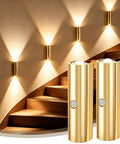 Dead Simple To Install Hella Bright Motion Sensor Wall Lights Rechargeable Wireless Sconces on a staircase wall illuminating steps.