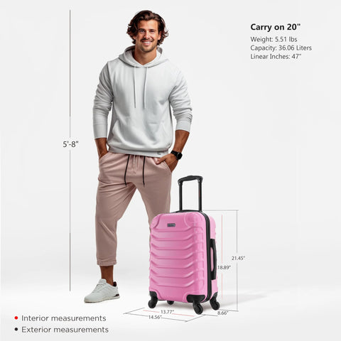 Man standing next to pink carry-on luggage showing size