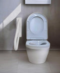18 Inch Tough As Nails Metal Outdoor Handrail U Shaped White Powder Coated Wall Mount Stair Railing With Non Slip Grip Solid Frame Built Different For Patio Deck Steps next to a white toilet in a modern restroom.