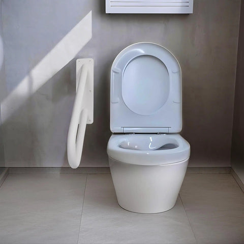 18 Inch Tough As Nails Metal Outdoor Handrail U Shaped White Powder Coated Wall Mount Stair Railing With Non Slip Grip Solid Frame Built Different For Patio Deck Steps next to a white toilet in a modern restroom.