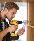 Man using Super Handy Drill Dust Catcher Attachment while drilling into wood, designed to keep workspace clean during DIY projects.