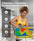 Woman using T2 Ultra Percussion Massage Gun With Heated Infrared Red LED Therapy For Deep Tissue Muscle Recovery on leg indoors