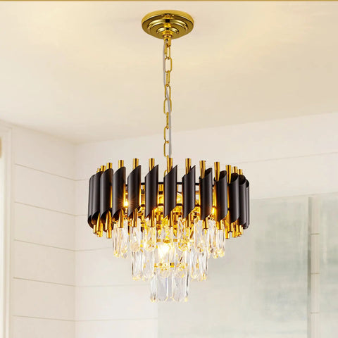 Gold and black modern chandelier with teardrop crystals in dining room