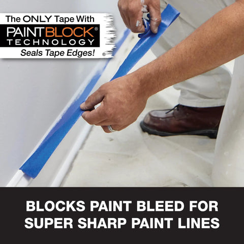 Applying ProGrade Painter Tape With PaintBlock Technology Blue 1.5 Inch Wide Multi Surface Masking Tape Medium Adhesion to baseboard