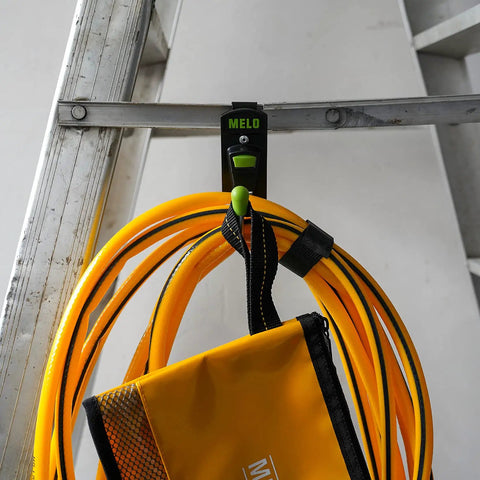 180 Degree Rotating Cordless Drill Holster Hook with Foldaway Design holding power cord on ladder