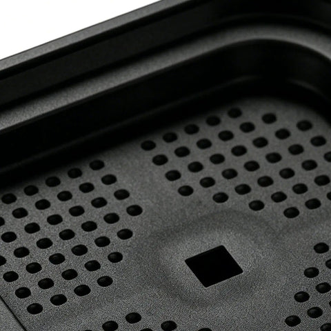 Close-up of anti vibration pad with textured surface for washing machines and dryers, heavy duty floor protection and shock absorbing guards.