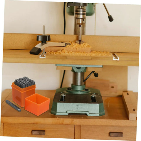 37 Piece Metal Stamp Set With Alphabet And Number Punches A To Z And Heart Symbols for crafting on a woodwork bench