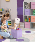 11 Inch Foldable Storage Bins With Handles Set Of 6 In Pastel Orange Purple And Pink in a playroom setting with toy storage
