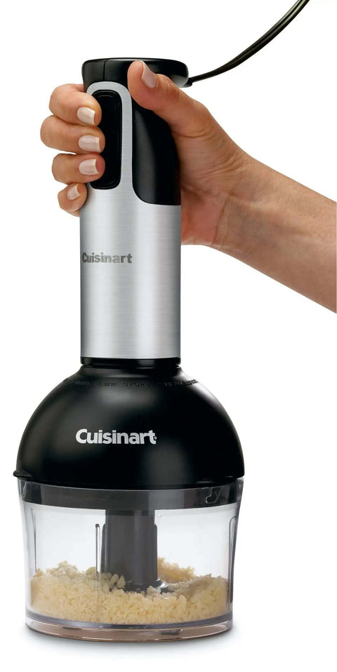 Slick 200 Watt Immersion Hand Blender With Brushed Stainless Steel Build Ergonomic Grip And Multi Attachments in use for chopping ingredients.
