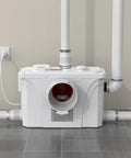 900W Copper Macerator Pump With Automatic Sink Pump installed in a plumbing setup showing pipes and connections