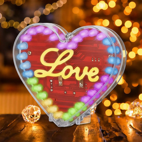 Heart Shaped LED Soldering Kit With Diffused 4 Pin RGB LEDs Love Filament DIY Electronics Project For Students Dope Solder Practice Mother's Day Gift Creative School Education Kit displaying lit LEDs on wooden surface