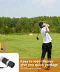 Golfer using rangefinder from the All In One Golf Gear Set With Leather Case Rangefinder Balls Tees Brushes Ball Markers Clips Divot Tool And Scoreboard Perfect Gift For Men And Women Who Live For The Course on a sunny day