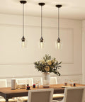 Matte Black Pendant Light For Kitchen Island With E26 Base And Adjustable Cable, Glass Cylinder Shade in dining area