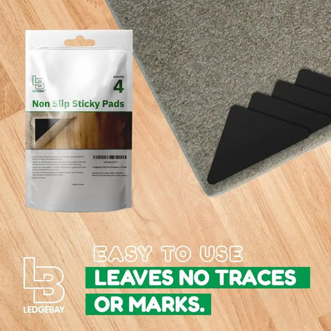 Non Slip Rug Pad Grippers Corner 4 Pack, Double Sided Self Adhesive, shown with package and applied to rug corner on hardwood floor.