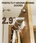 Two Pack Wall Mounted Coat Rack Set With Heavy Duty Hooks For Coats Hats And Bags, shown hidden behind a door, slim white finish