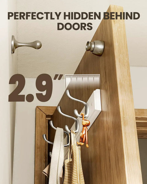 Two Pack Wall Mounted Coat Rack Set With Heavy Duty Hooks For Coats Hats And Bags, shown hidden behind a door, slim white finish