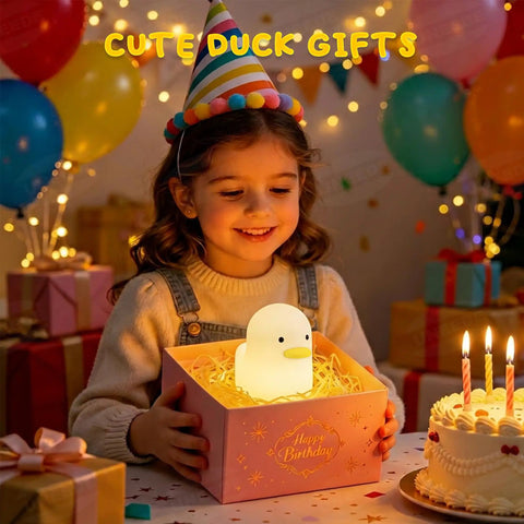 Girl holding a Cute Duck Night Light For Nursery And Bedroom, Rechargeable Silicone Baby Lamp With Touch Sensor in a gift box.