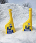 Two bottles of Water Removal and Gas Line Antifreeze for Winter Starts Keeps Your Fuel System Free of Water Prevents Gas Line Freezing and Rust Protection Plus Easy Starts in Cold Weather 12 Fl Oz in the snow