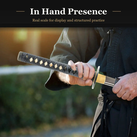 Close-up of Wakizashi Iaito For Iaido Training, Unsharpened Stainless Steel Sword With 21 Inch Fuller Blade held by a person in practice stance.