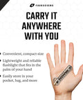 Beta Quick Release V2 Keychain LED Flashlight held in hand, demonstrating compact and portable size for everyday carry.