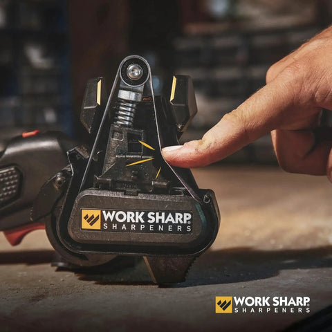 Close-up of a hand adjusting a Work Sharp sharpener, compatible with Pro Grade Replacement Belt Kit For Knife And Tool Sharpener series.