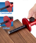 Professional Wheel Marking Gauge With Micro Adjustment For Woodworking Dang Accurate Dual Metric And Imperial Scale Carbide Scriber shown measuring inches and centimeters on wood.