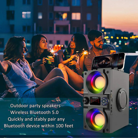 Beast Mode 40W Portable Bluetooth Speaker with Colorful Lights at an outdoor party, showing dual subwoofers and heavy bass