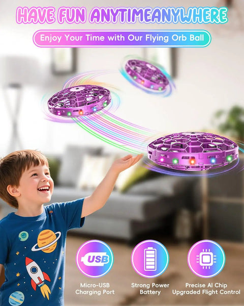 Mini UFO Flying Toy Drone for Kids with 360-Degree Gesture Control and LED Lights hovering, boy enjoying indoor play.